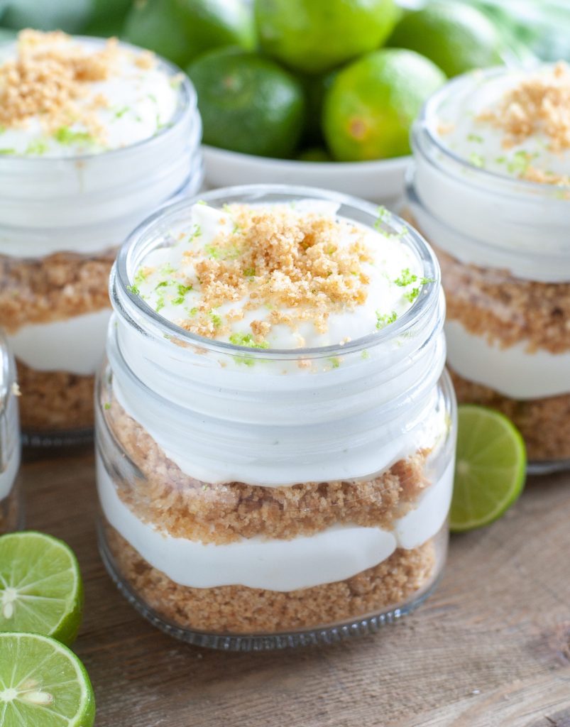 3 jars of key lime trifles. Key limes around the jars