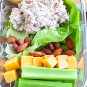 Container with tuna salad, celery and cheese.