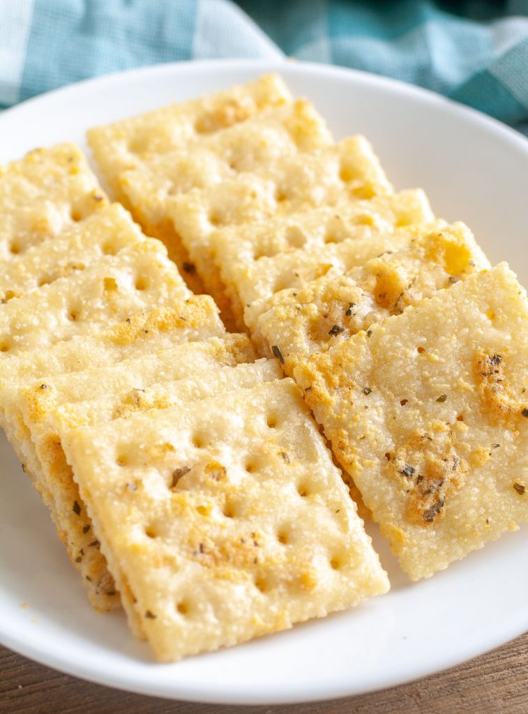 Ranch Crackers lined up on a plate. 