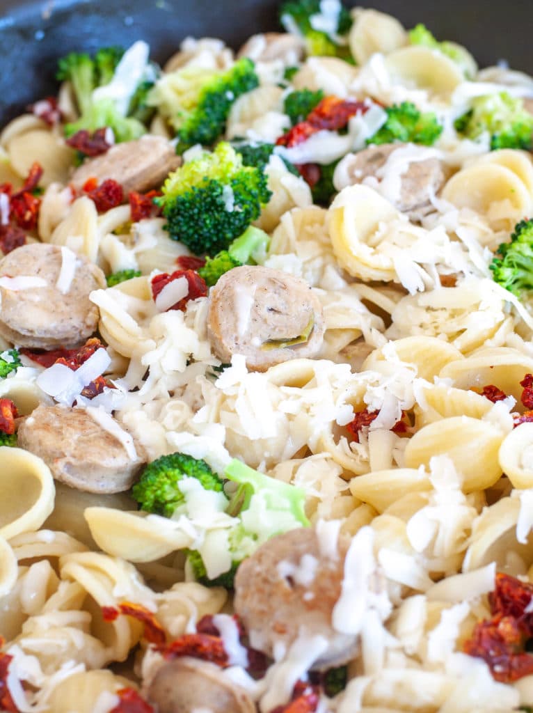 Orecchiette with chicken sausage and broccoli in a skillet