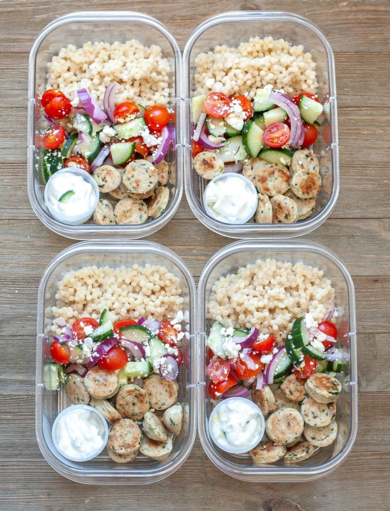 Four Greek Meal Prep Bowls on a table