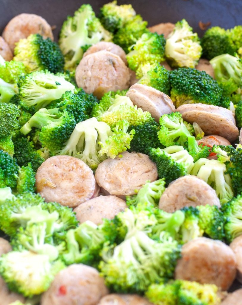 Chicken sausage and broccoli in a skillet