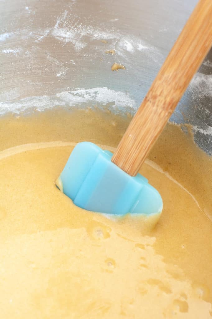 blondie in a batter with a spatula