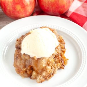 Plate with apple cobbler and ice cream.