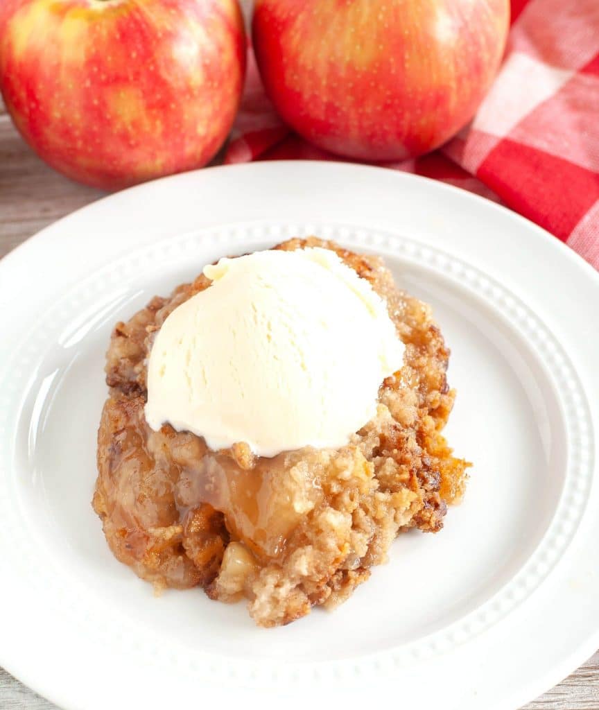 Apple Dump Cake with a scoop of vanilla ice cream on top. 