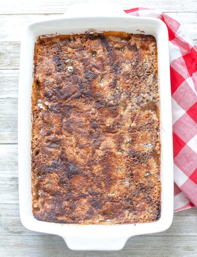 Baked apple pie dump cake in a casserole dish. 