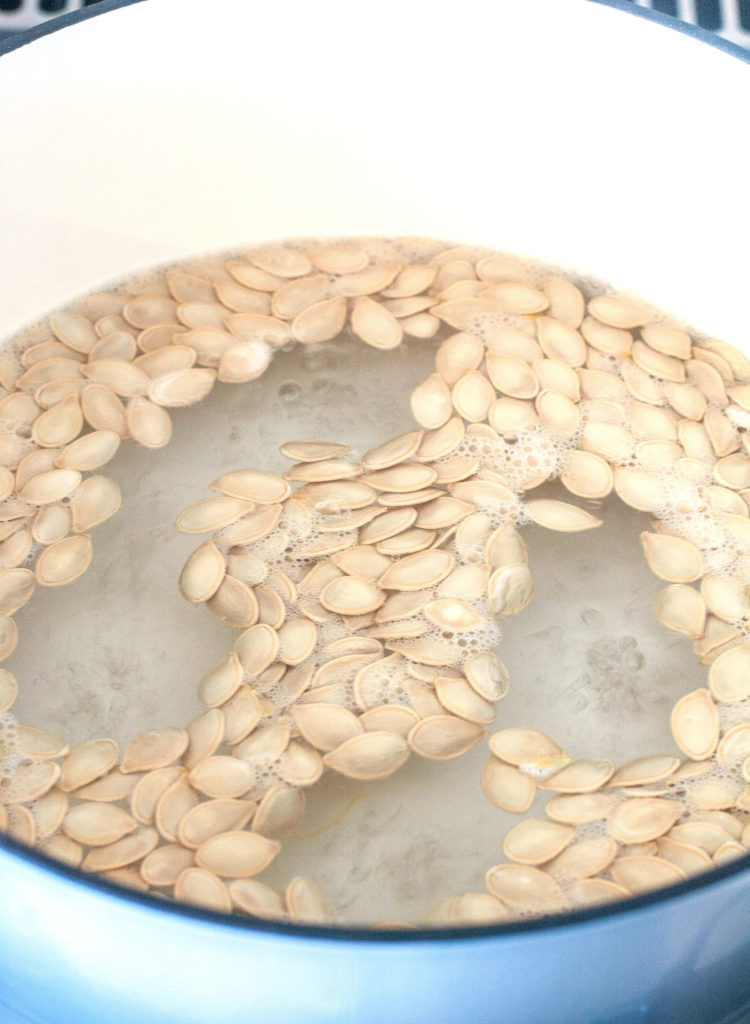 Pumpkin Seeds in a pot of boiling water