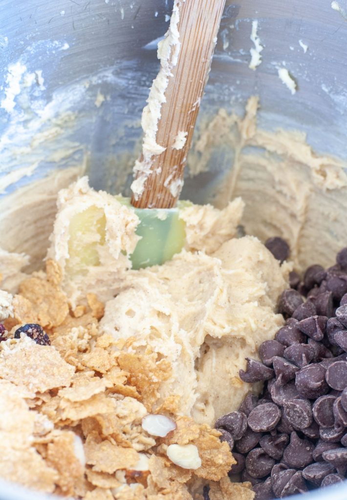 Cereal, chocolate chips, dough in a mixing bowl