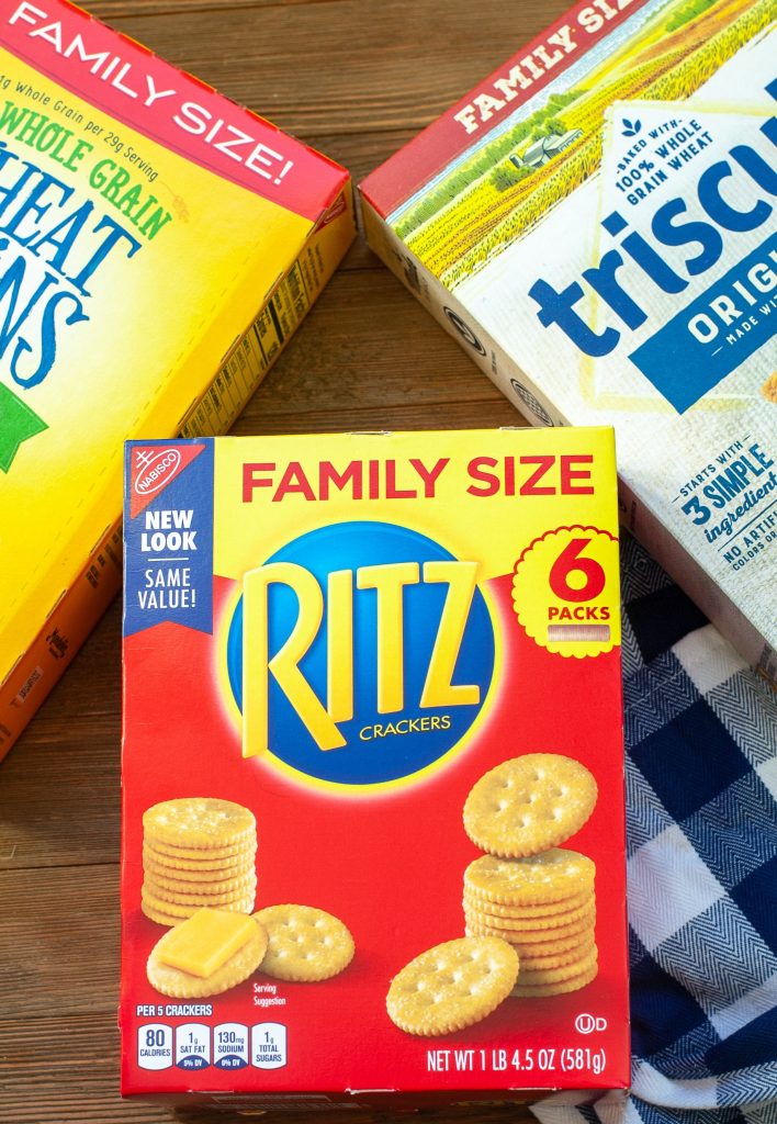 A box of Ritz Crackers, triscuit and wheat thins