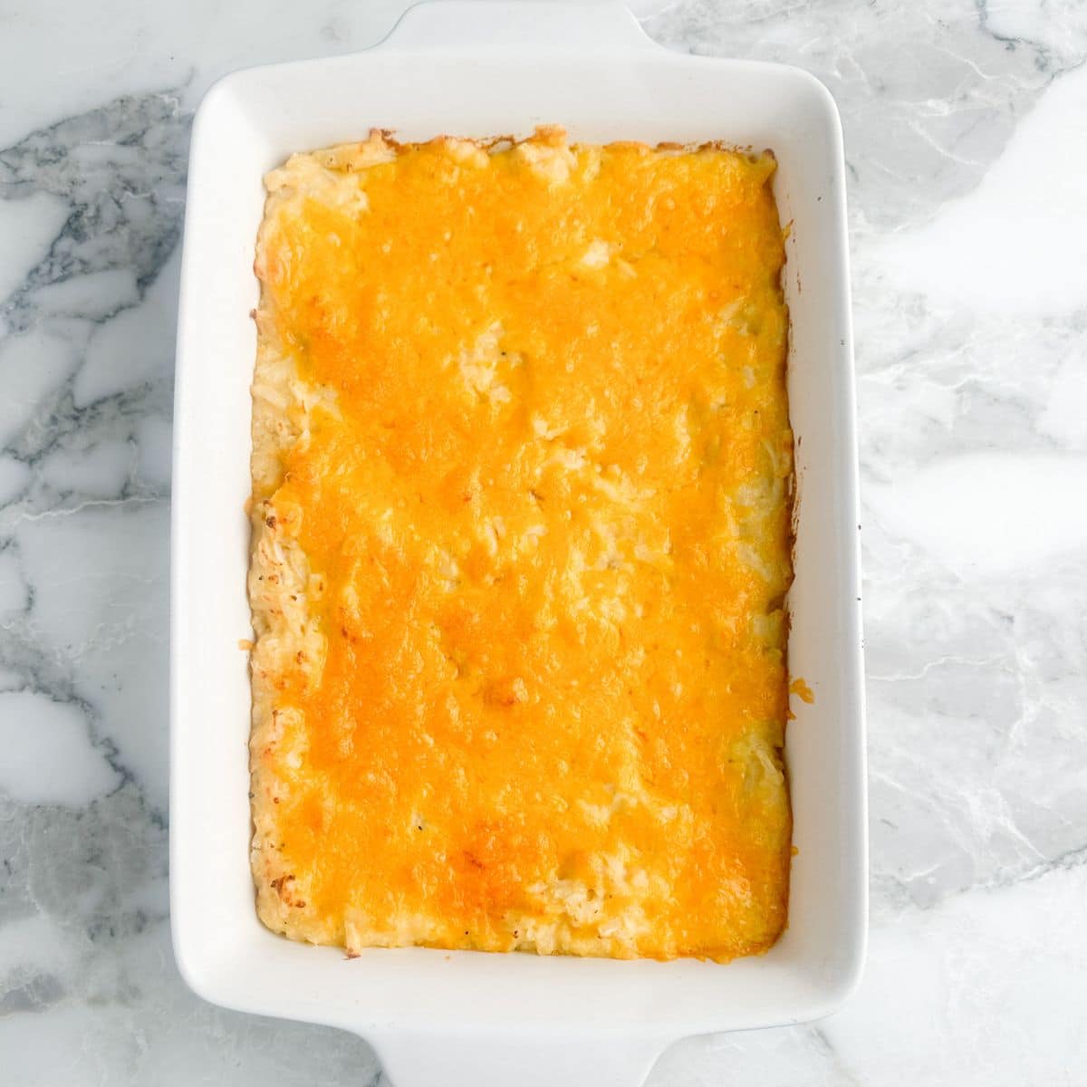 Hash brown casserole in a casserole dish.