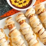 Hot dogs wrapped in crescent rolls with ketchup and mustard