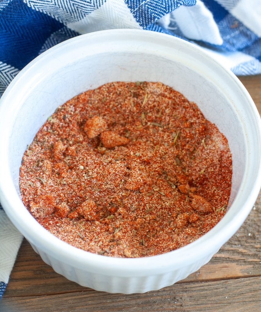 Chicken dry rub spices in a white bowl