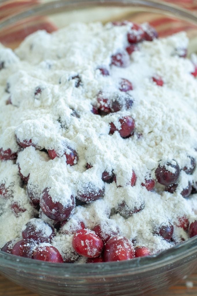 Bowl of cherries and cranberries with sugar on top