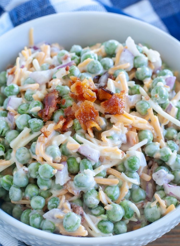 Pea salad topped with crumbled bacon