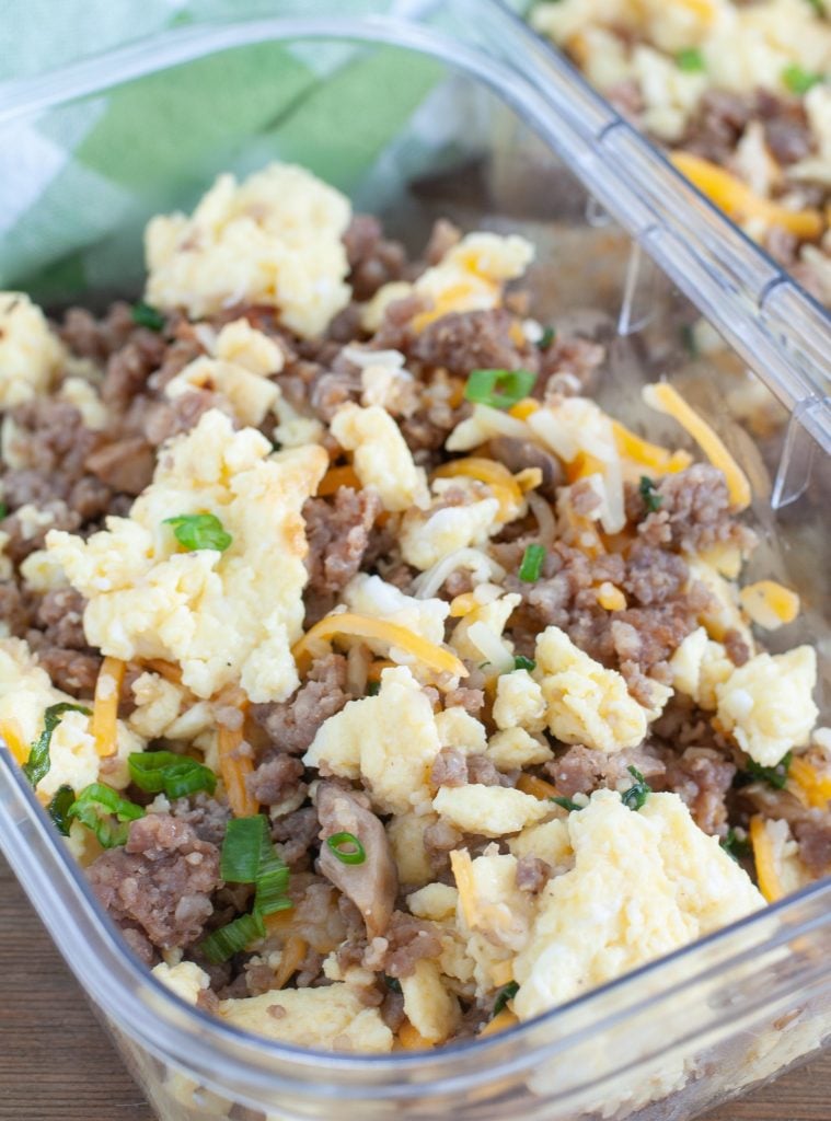 Container with sausage, scrambled eggs and cheese. 