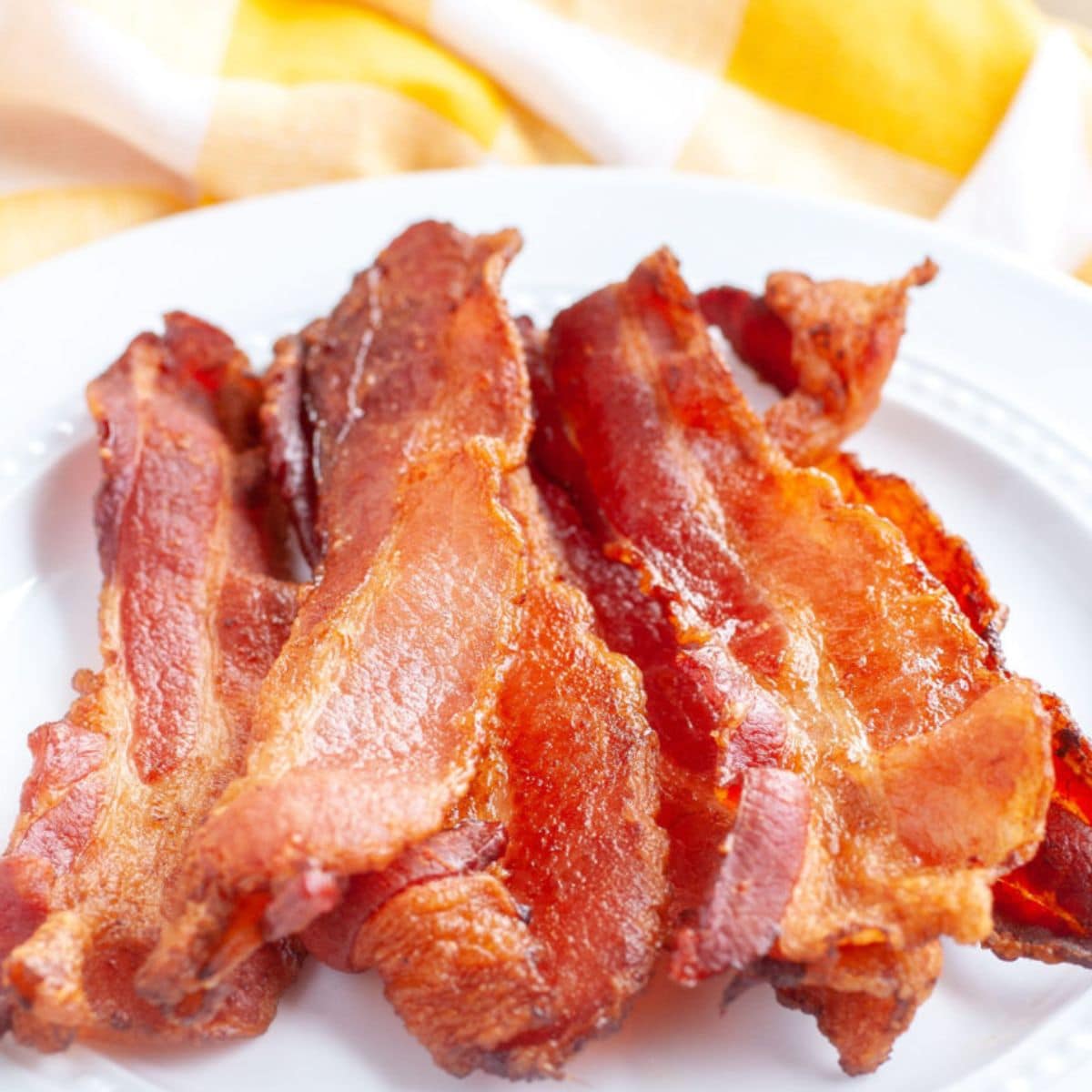A plate of cooked bacon.