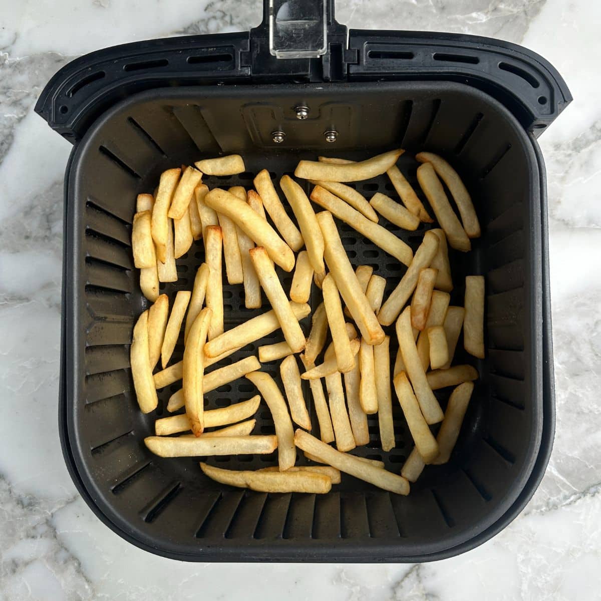 Basket of cooked french fries.