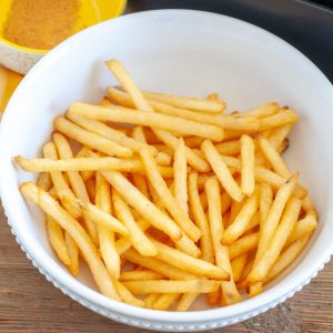 Air Fryer Frozen French Fries Cooked in a bowl