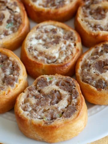 Sausage cream cheese rolls on plate.