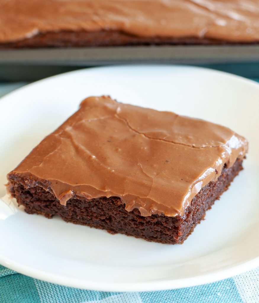 Chocolate sheet cake on a white plate