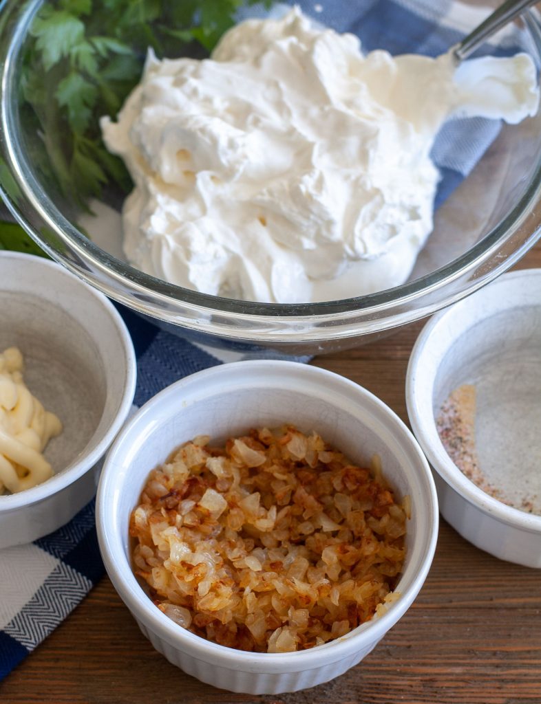 Bowl of sour cream, mayo, onions and spices