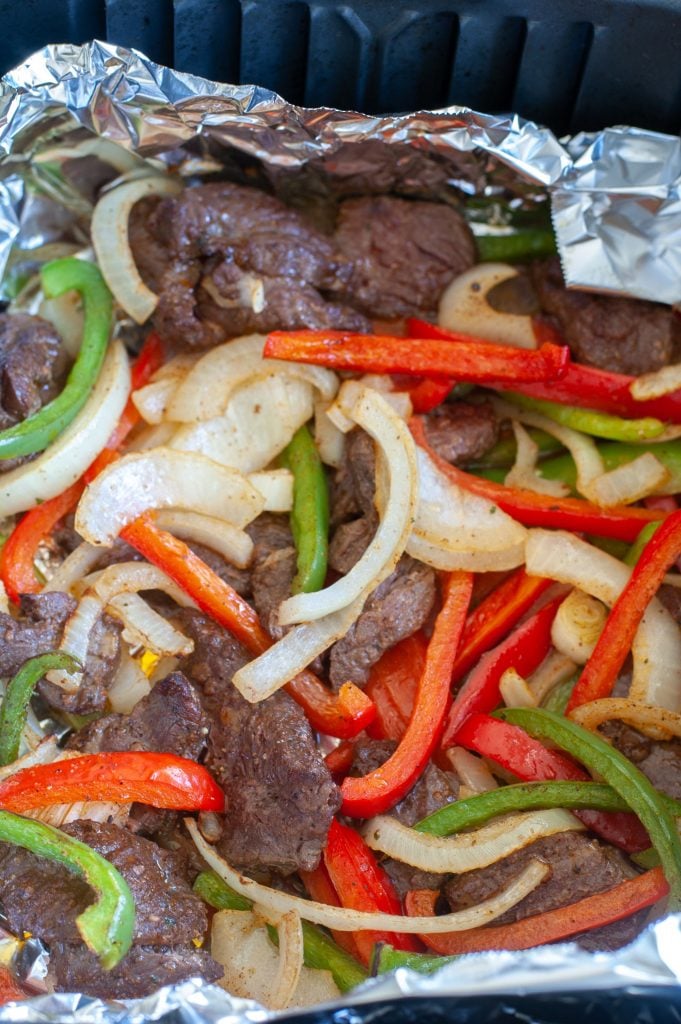 Steak, peppers and onions  in foil