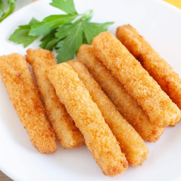 fish sticks on white plate with parsley