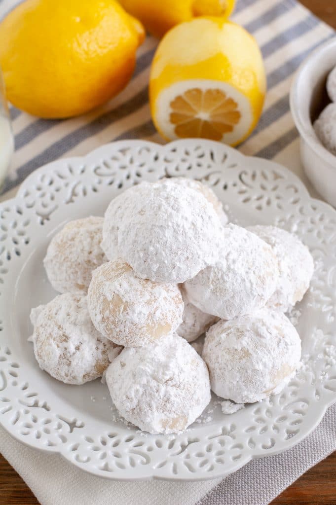 snowball cookies stacked on plate