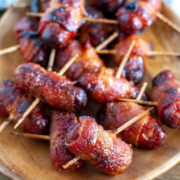 bacon wrapped smokies on a plate