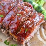Cooked air fryer meatloaf with sauce.