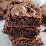 Stack of brownies on table.