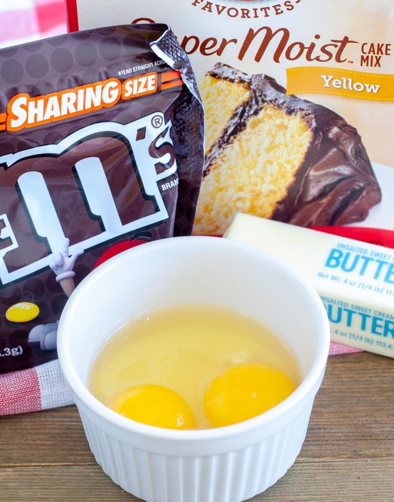 bag of m&m's, eggs, butter, cake mix