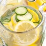 Pitcher of water with lemon and cucumber.