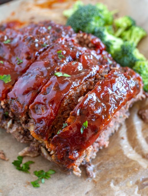 meatloaf on parchment paper with broccoli