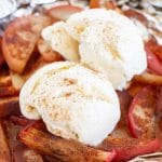 Apples in foil topped with ice cream
