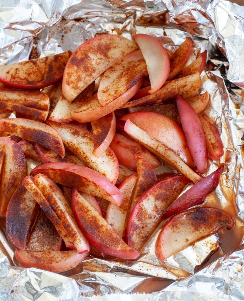sliced apples with cinnamon and sugar in foil