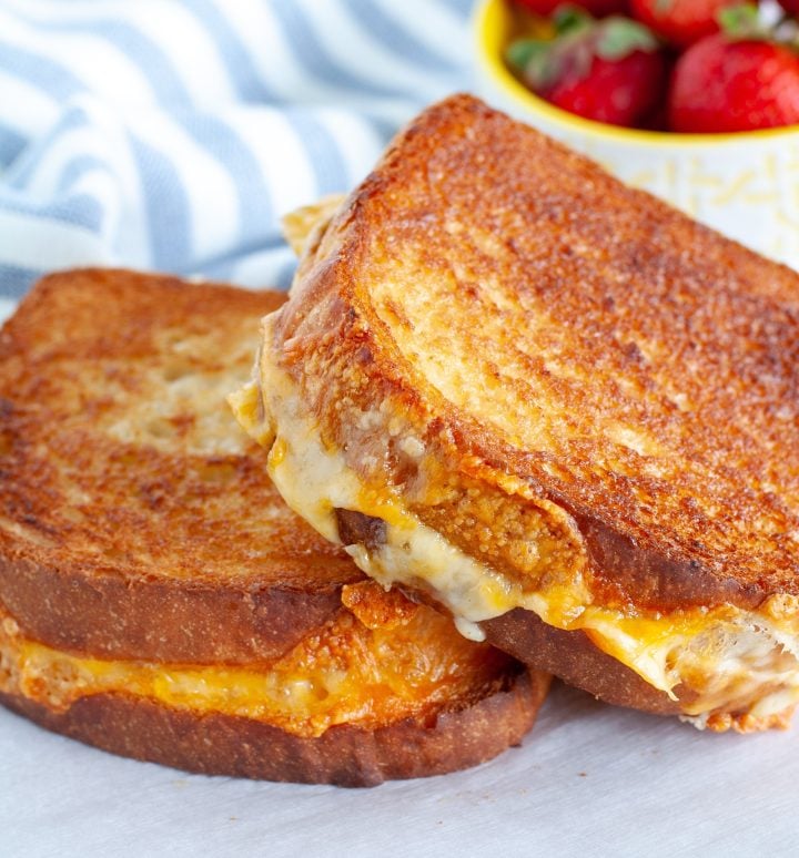 2 grilled cheese sandwiches on a plate