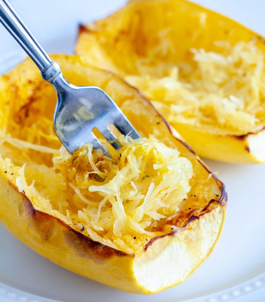 Cooked squash with a fork. 