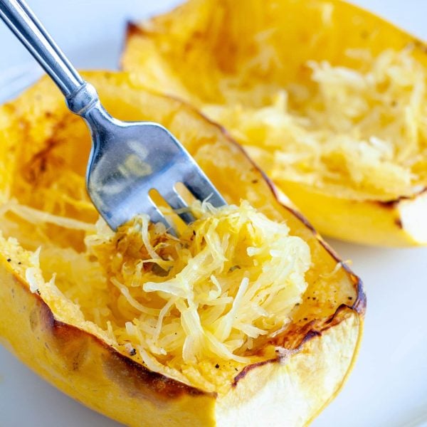Cooked squash with a fork.