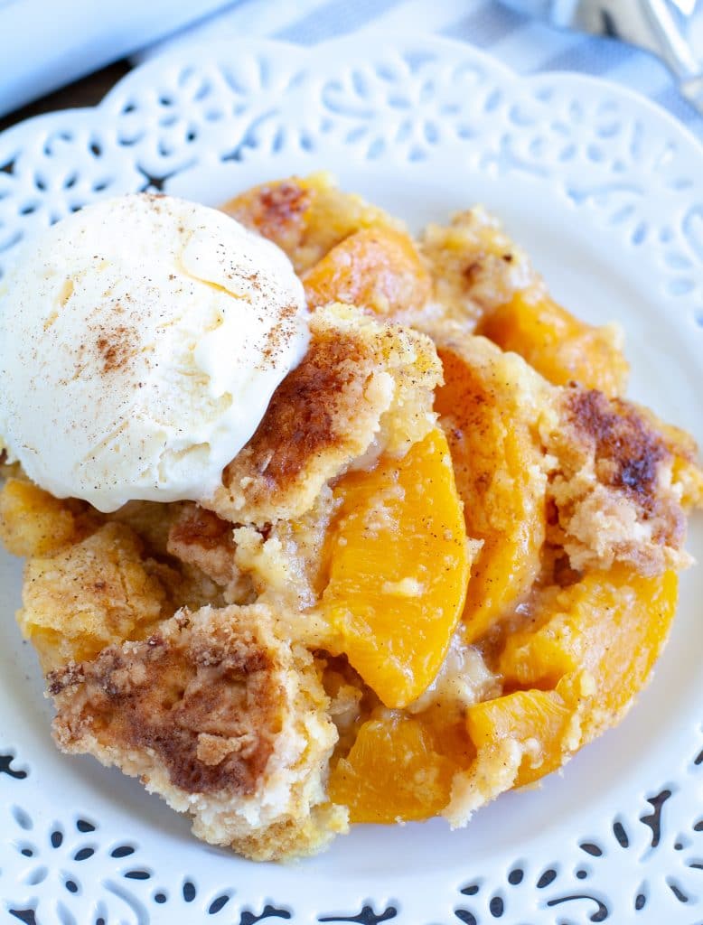 peach cobbler on plate with ice cream
