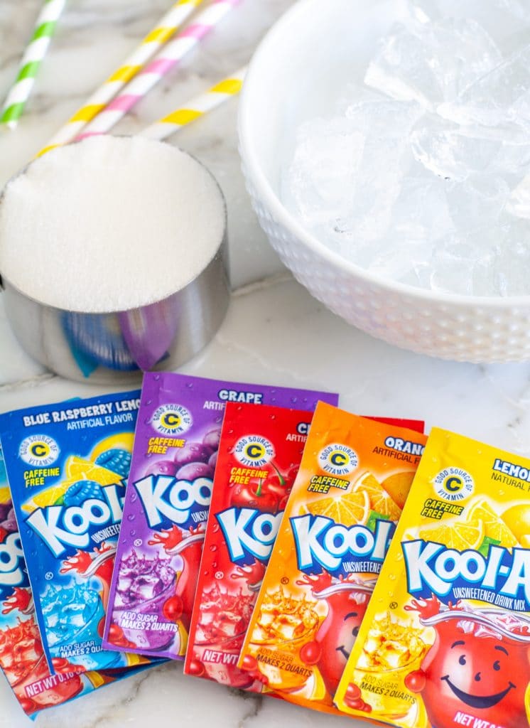Packets of Kool-Aid, Ice in bowl and sugar