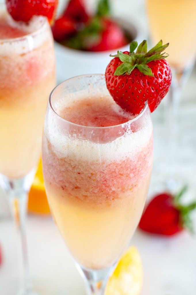 Glass with champagne and a strawberry. 