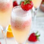 mimosa in glass with strawberry
