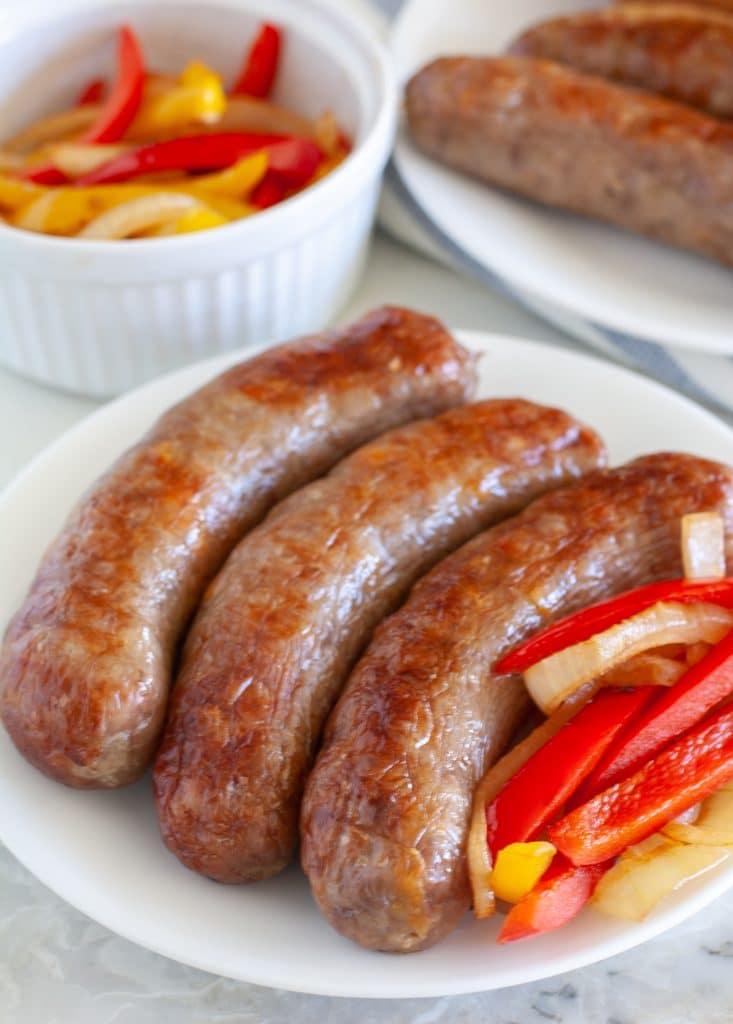 Sausages on a plate with peppers