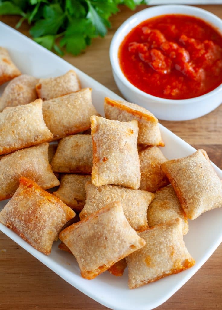 pizza rolls on plate with marinara sauce