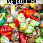 Roasted mixed vegetables in air fryer basket.