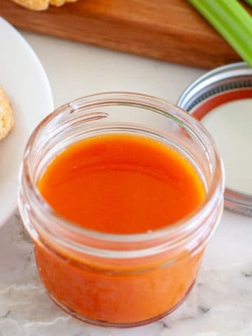 Jar with red sauce.