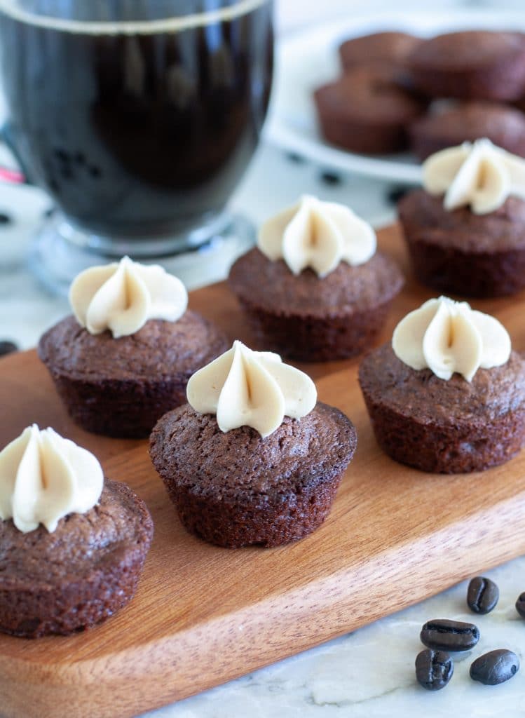 Brownie bites with frosting on a plate