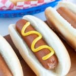 three hot dogs on a plate