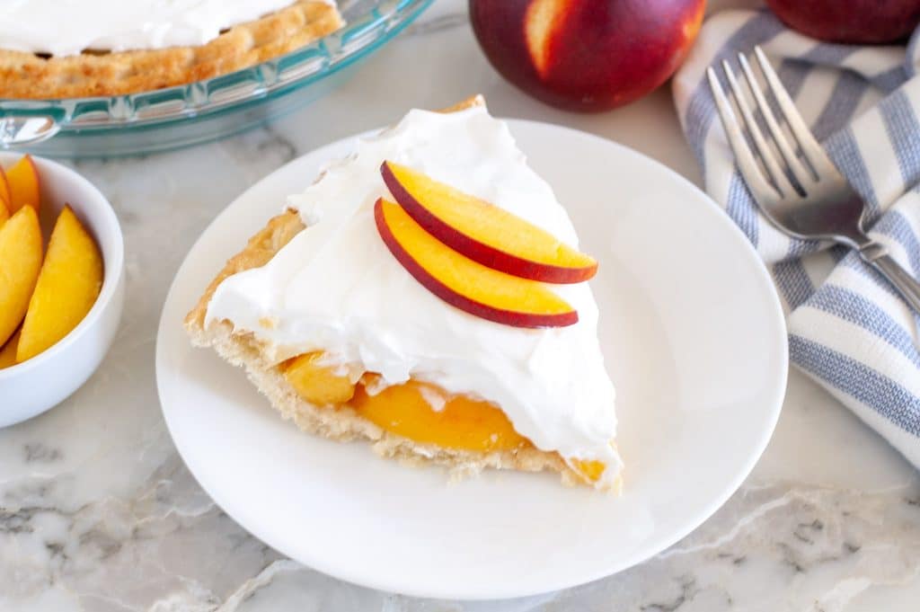 peach cream pie on a plate